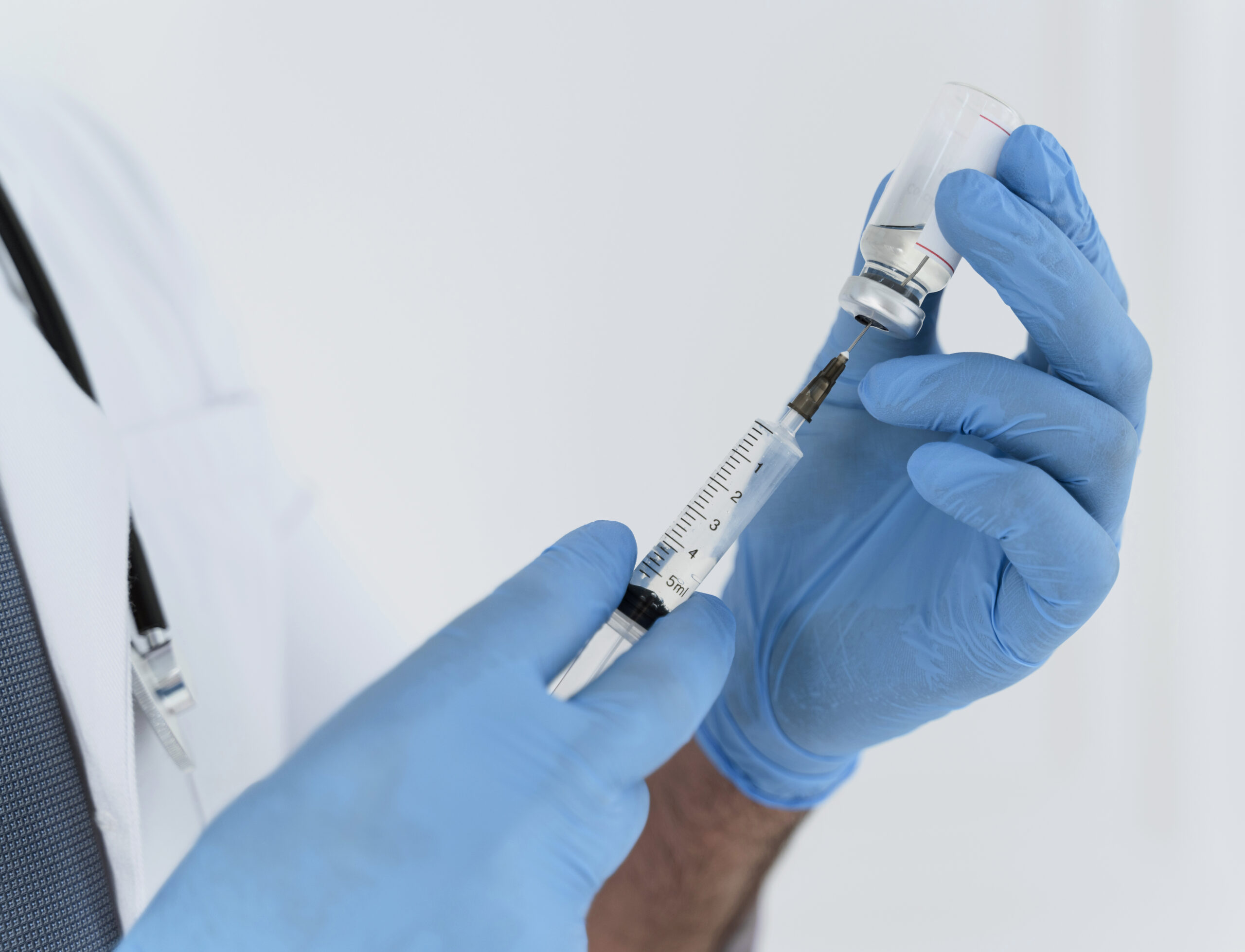 doctor-holding-a-syringe-close-up