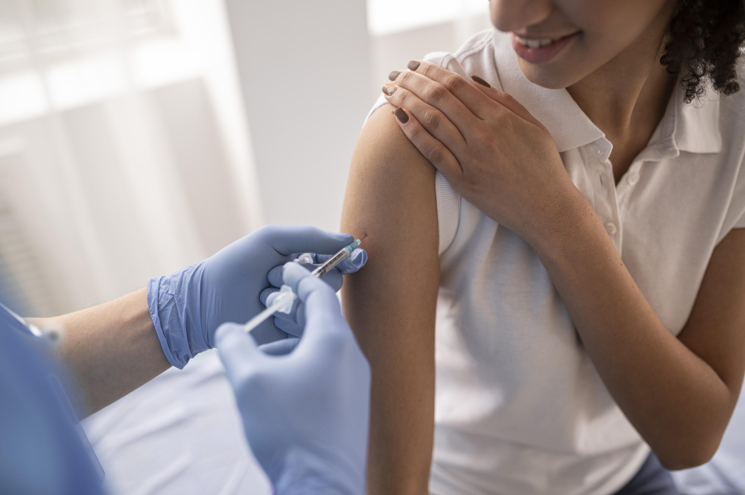 doctor-vaccinating-a-patient-in-a-clinic